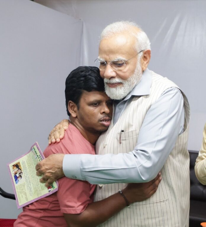 PM Modi meets autistic singer Kamisetty Venkat in Warangal